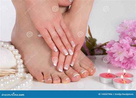 Pampering Perfection French Nail Polish On Beautiful Female Feet And