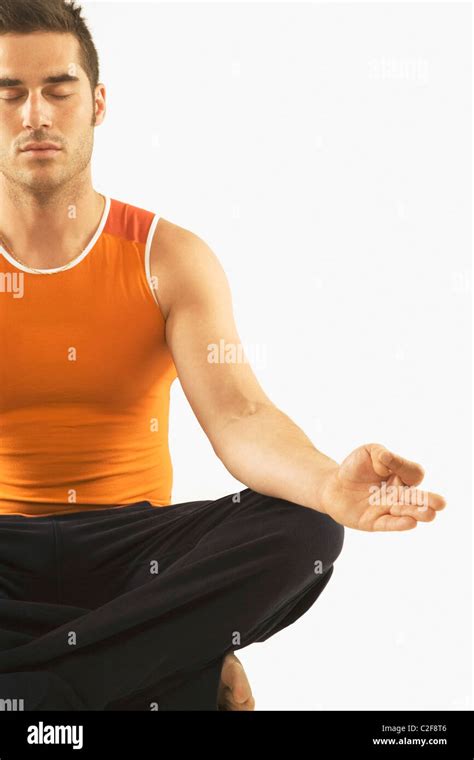 Man In A Yoga Pose Stock Photo - Alamy