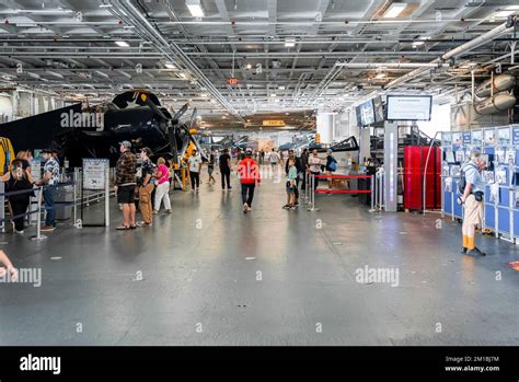 Tourists at exhibition in USS Midway aircraft carrier museum Stock ...