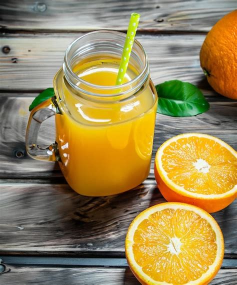 Premium Ai Image Glass Jar Of Fresh Orange Juice With Fresh Fruits