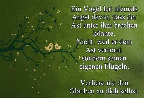 Two Birds Sitting On Top Of A Tree Branch With Words Written In German