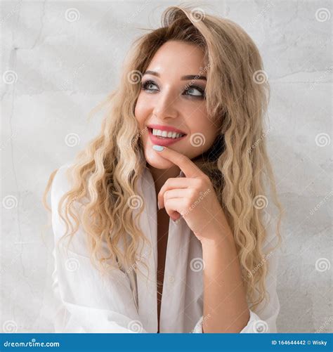 Smiling Blonde Sitting On The Floor In Studio Stock Photo Image Of Caucasian Lady 164644442