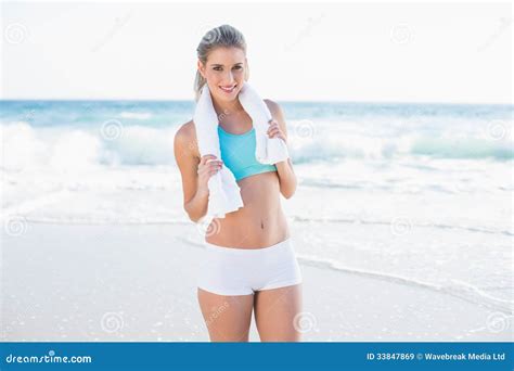 Cheerful Sporty Blonde In Sportswear With Towel Around Neck Stock Image