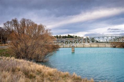 Premium Photo The Lake Tekapo Foot Bridge Over The Scott Pond