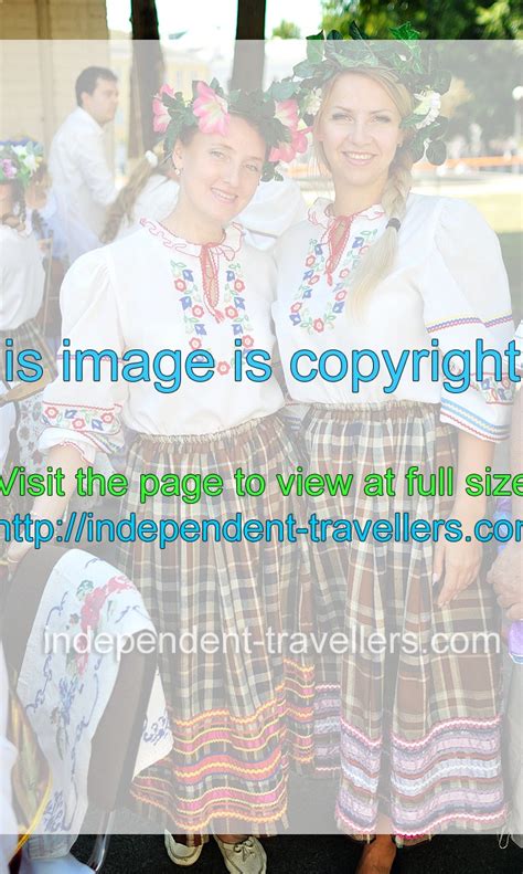 Two attractive Belarusian women wear national dresses - Independence ...