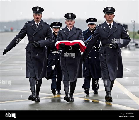 Polish and U.S. Air Force honor guard march to the flag poles during the Aviation Detachment ...