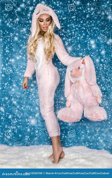 Beautiful Blonde Woman Wearing A Pajama A Bunny Costume Smiling