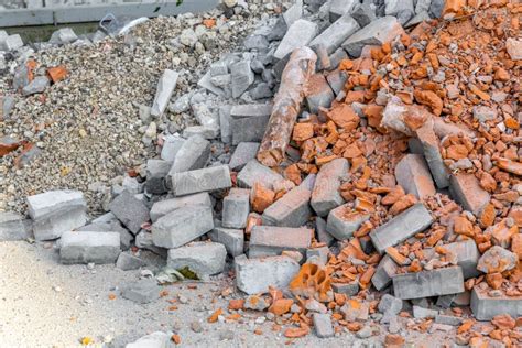 Construction Waste A Pile Of Red Broken Bricks Concrete Debris And