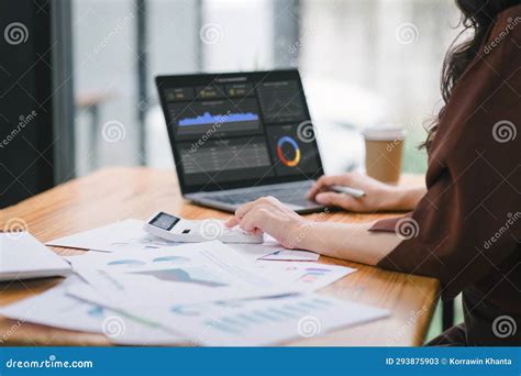 The Data Analyst Woman Working On A Business Analytics Dashboard Utilizing Charts And Metrics