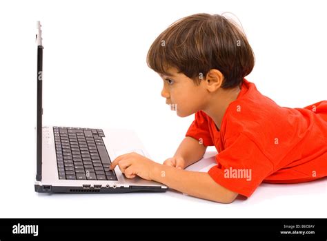 Boy Accessing The Internet From The Laptop Stock Photo Alamy