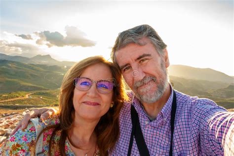 Couple Of Mature Man And Woman Taking A Selfie On A Tourist Trip In Early Retirement Stock