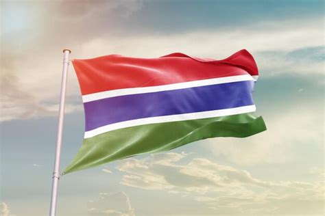 Premium Photo The Gambia Flag Waving In Beautiful Sky