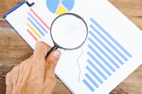 Premium Photo Magnifying Glass Looks At Statistics