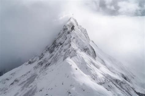 Premium Ai Image Majestic Snow Capped Mountain Peak In Alpine Landscape