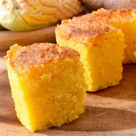 Two Pieces Of Cake Sitting On Top Of A Wooden Cutting Board