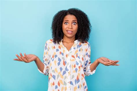 Photo Of Impressed Millennial Curly Hairdo Lady Shrug Shoulders Wear