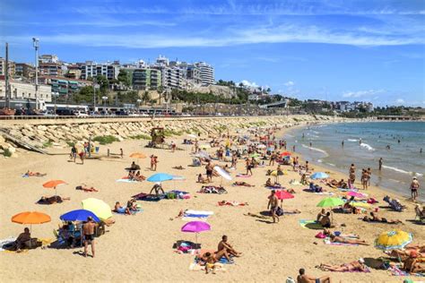 Sunbathers at Miracle Beach in Tarragona, Spain Editorial Photo - Image ...