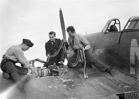 Armourers Replenish The Ammunition In Hawker Hurricane Mk I P3143 Nn D