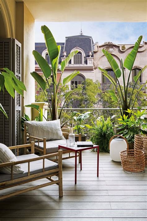 Picture Of A Relaxed Balcony With Rattan Furniture Candle Lanterns And