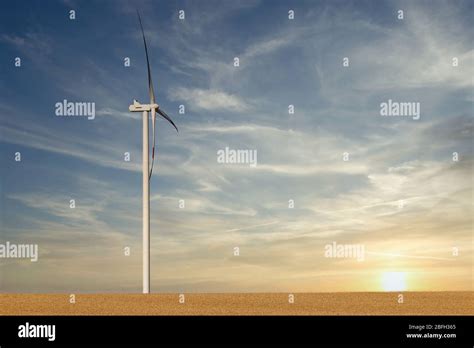 wind turbine in the wheat field sunset landscapes Stock Photo - Alamy