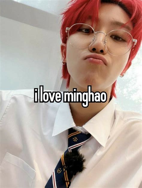 A Girl With Red Hair Wearing Glasses And A Tie That Says I Love Minghao