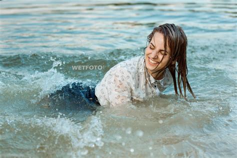 Swimming By Soaking Wet Blonde Girl In Sexy Tights Mini Skirt And Shoes With High Heels