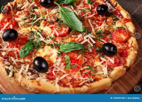 Fresh Pizza With Tomatoes Cheese And Mushrooms On Wooden Table Closeup