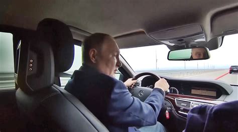 Watch Putin Drives Across Crimea Bridge Hit By Blast Says It Needs