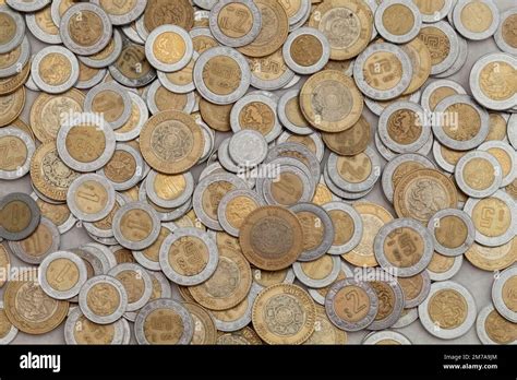 group of mexican peso coins of various denominations, with copy space ...