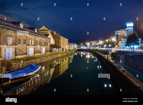 Night view of the Otaru canal and an old warehouse next to the port in ...