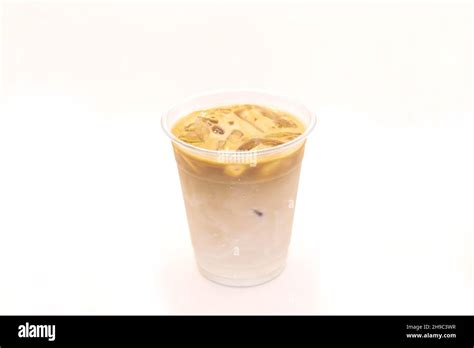 hazelnut caramel vanilla iced latte served   plastic   cup stock