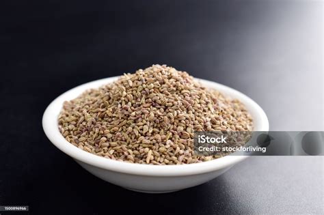 closeup  ajwain seeds  dark background stock photo  image