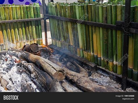 Cooking Lemang, Type Image & Photo (Free Trial) | Bigstock