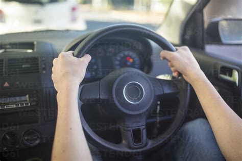 Male Hands In Car Holding Steering Wheel Stock Photo