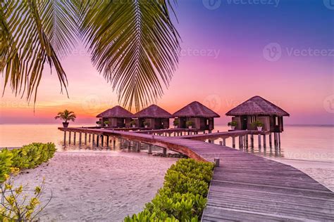 Maldives island sunset. Water bungalows resort at islands beach. Indian Ocean, Maldives ...