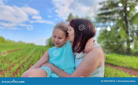 Happy Mother And Daughter Enjoying Rest Playing And Fun On Nature In