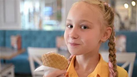 Cute Girl Brunette With Pigtails Eats Ic Stock Video Pond5