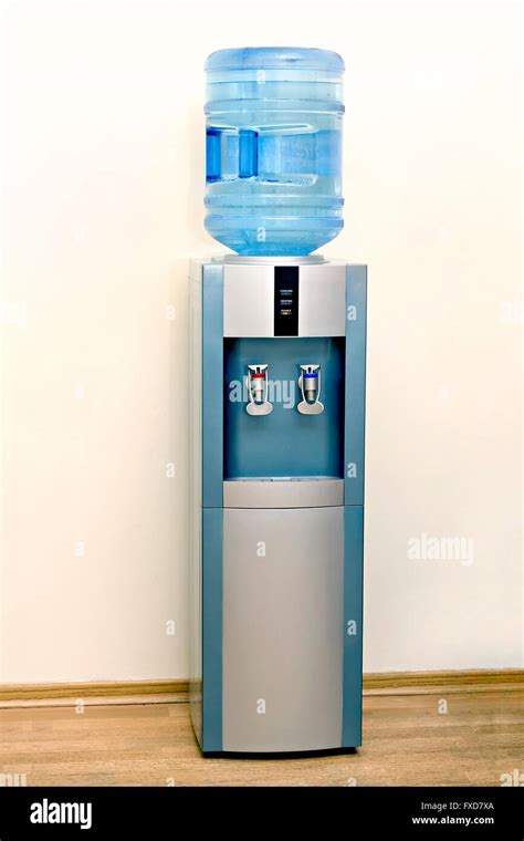 Electric Water Cooler Against The Background Walls Of The Office Stock