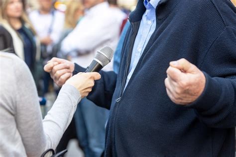 Premium Photo Journalist Making Media Or Vox Pop Interview With