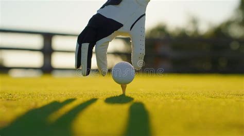 Golf Game A Golfer Hits The Ball In The Sunlight People Sport