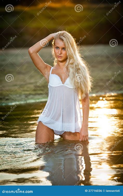 Sexy Blonde Woman In Lingerie In A River Water Royalty Free Stock Image