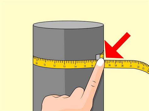 A Hand Is Measuring The Height Of A Cylinder With A Tape Around It And