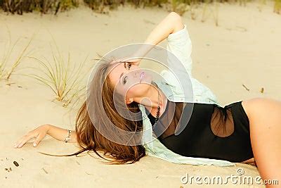 Adorable Girl Lying On Sandy Beach Stock Photography | CartoonDealer ...