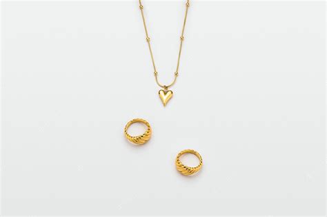 Premium Photo | Gold jewelry on white background