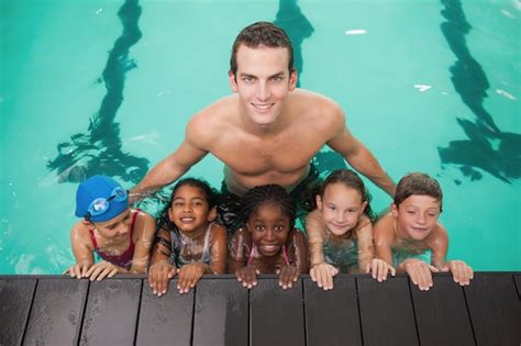 Premium Photo Cute Swimming Class In Pool With Coach