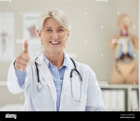 She Always Gives Good News A Mature Doctor Giving The The Thumbs Up Stock Photo Alamy