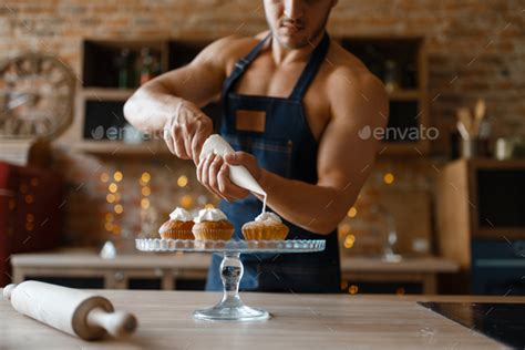 Nude Man In Apron Cooking Dessert On The Kitchen Stock Photo By Nomadsoul