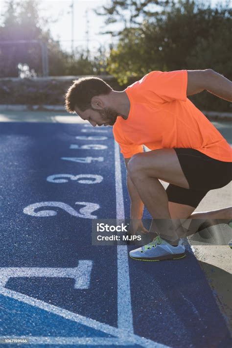 Young Athlete Man At Starting Position Ready To Start A Race Sprinters