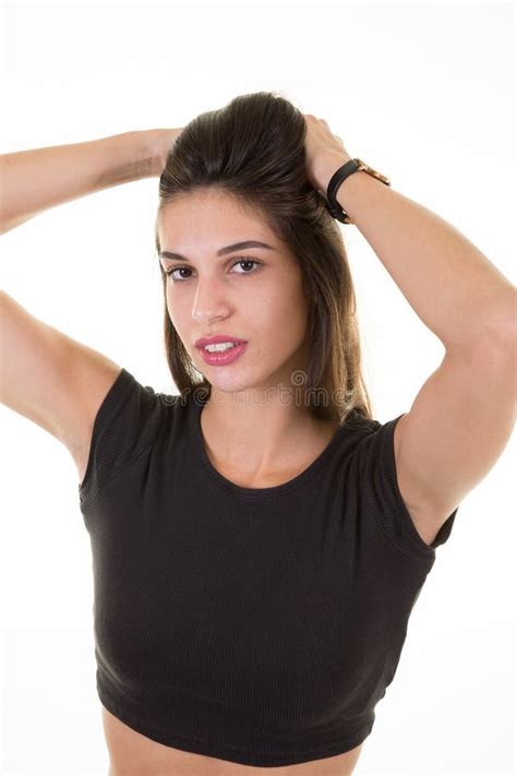 Beautiful Brunette Girl Touching Hair And Smiling On White Background