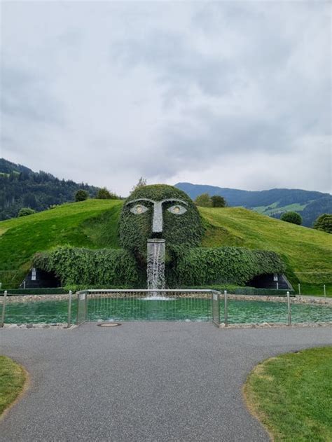 Scenic Green Park with Giant Head with Fountain · Free Stock Photo